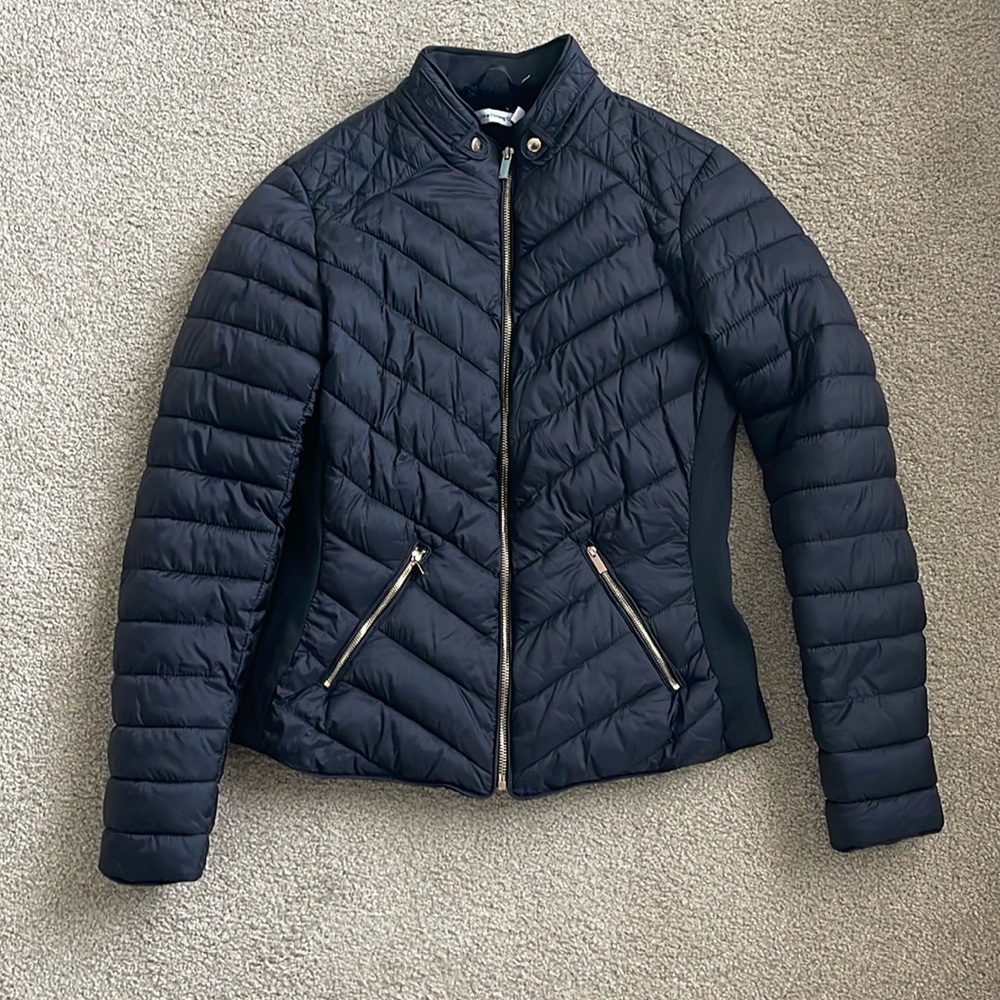 In new condition black jacket with cozy lining
